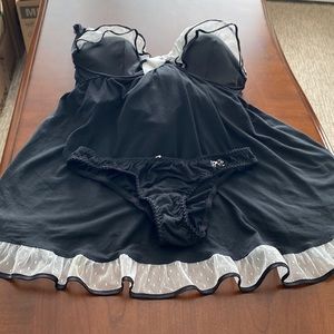 Never Worn Victoria secrets babydoll. Black with mesh polka dot ruffle trim.